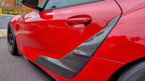 TRD-style carbon fiber door panel trim for Supra A90/A91