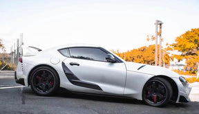 TRD-style carbon fiber door panel trim for Supra A90/A91